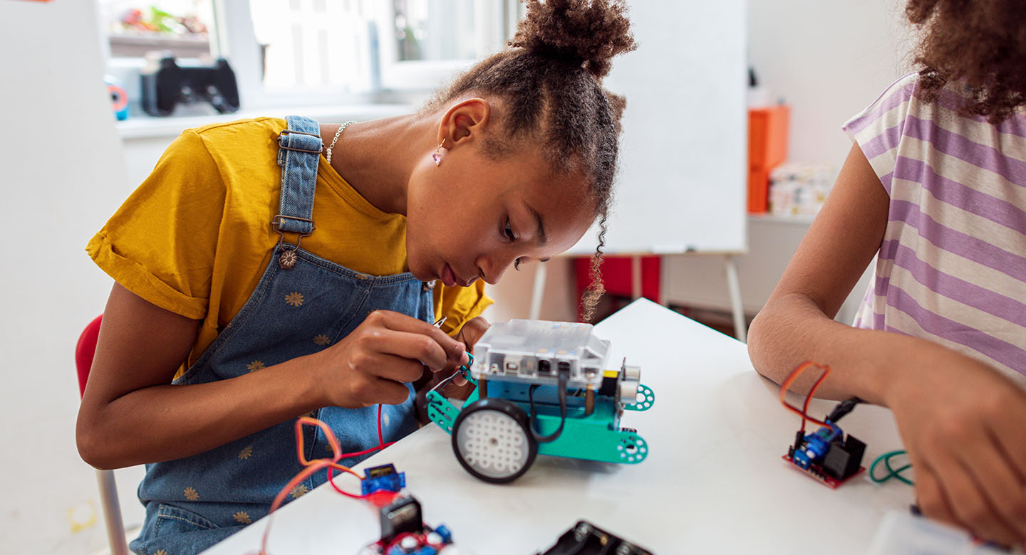 Middle school girl doing a STEM project at YMCA after school