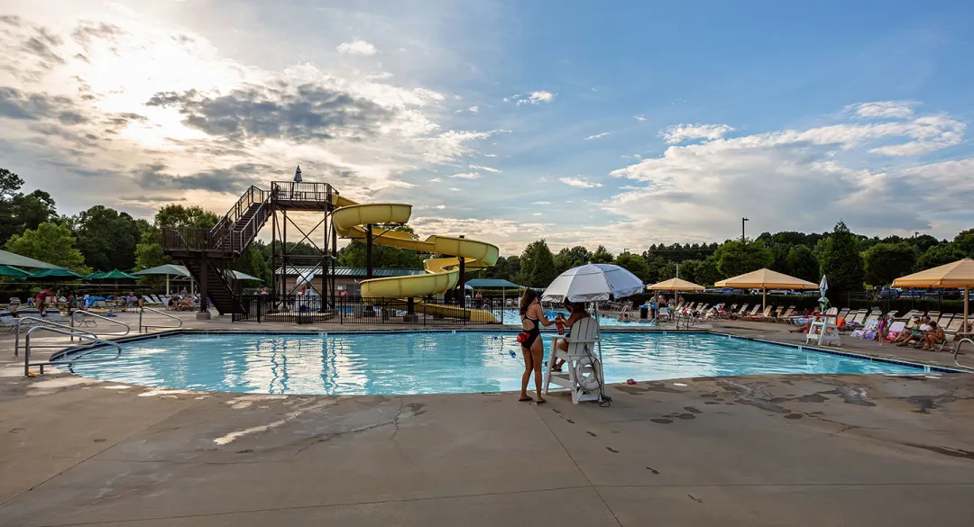 Outdoor pool and view of the slide at the Kraft Family YMCA