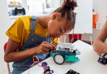 Middle school girl doing a STEM project at YMCA after school