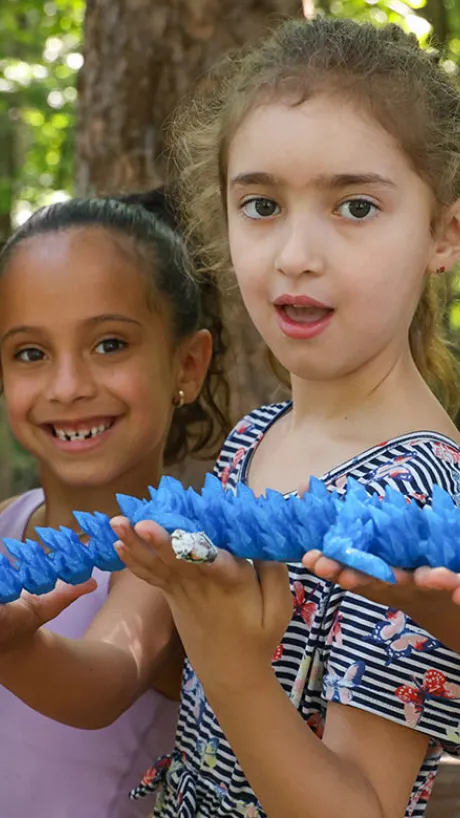 kids holding an art project
