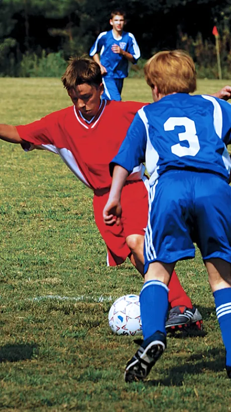 Kids participating in a soccer game