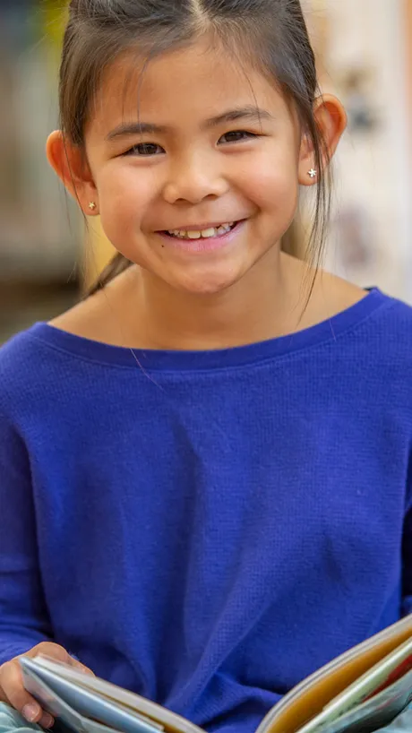 Young girl enjoying a book