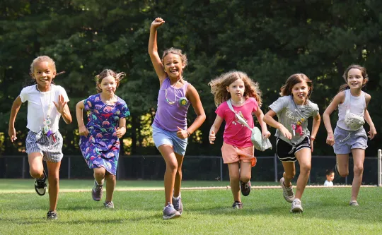 Group of girls running and smiling