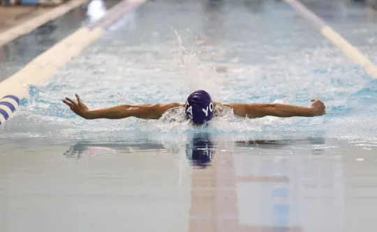 YOTA swimmer competing in the pool