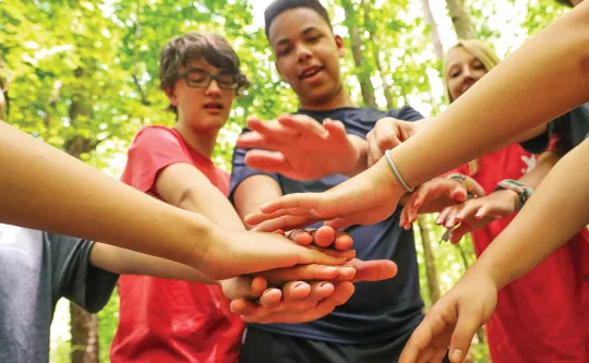 group of teens celebrating together