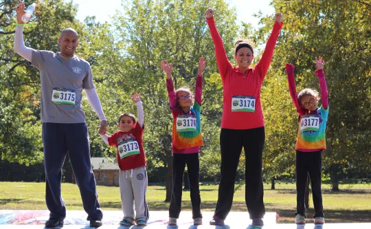 family celebrating at the end of a race