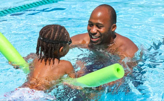 Father and son at the pool