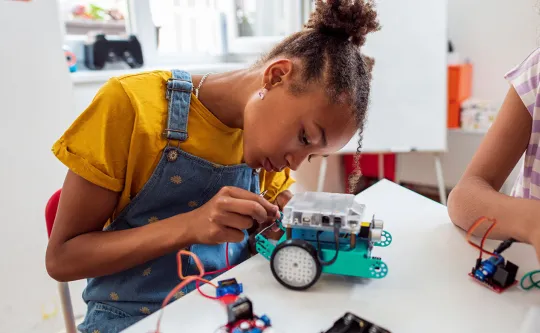 Middle school girl doing a STEM project at YMCA after school