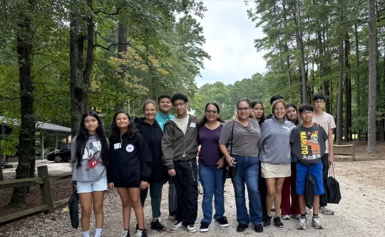 Groups of teens and parents at the LYA community celebration at YMCA Camp Kanata