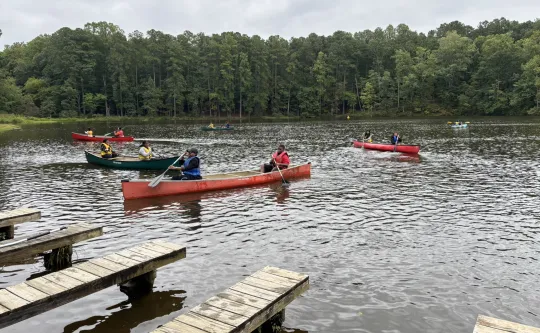 Teens from the Lightner Y Achievers program kayak at YMCA Camp Kanata