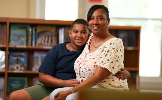 Mother and son smiling at YMCA Power Scholars