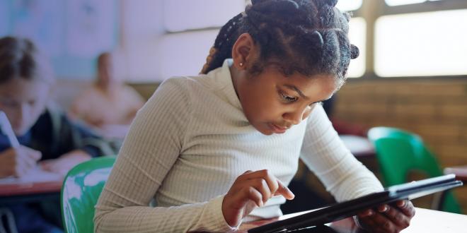 Girl in class with ipad