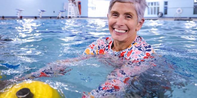 female senior at a water fitness class