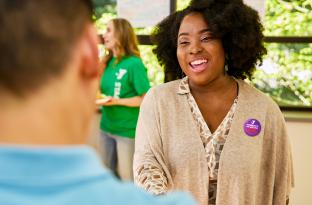 YMCA staff member giving someone a tour