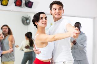 Couple taking a ballroom dance class