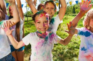 Kids laughing during a color run event