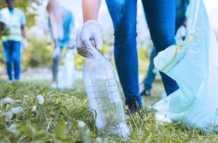 Volunteer picking up trash