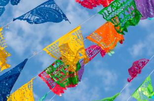 Mexican Celebration Flags against a blue sky