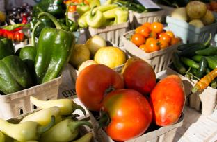grouping of fresh farm vegetables on a display