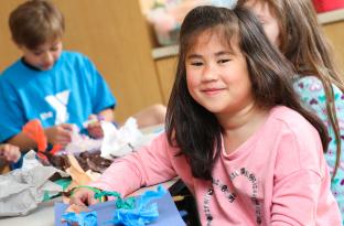 Girl with her art project