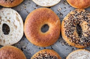 assortment of bagels on a parchment paper sheet