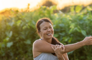 sunrise stretching woman sitting down 
