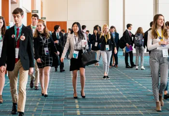 Teenagers walking in a room