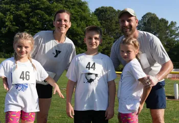 Family celebrating their finish at the Families On! race
