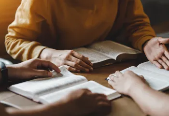 women reading the bible together