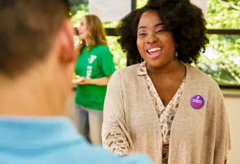 YMCA staff member giving someone a tour