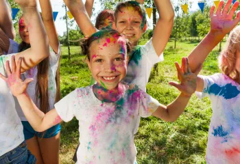 Kids laughing during a color run event