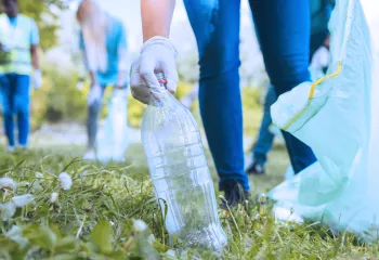 Volunteer picking up trash