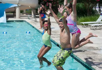 Kids jumping in the Meadowmont pool