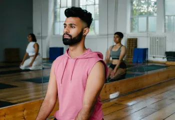 Male focused shot in a yoga position 