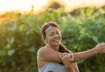 sunrise stretching woman sitting down 