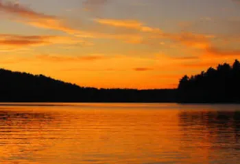Gold yellow and orange sunset across the Jordan Lake
