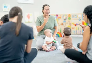 mom and baby learning sign language together 