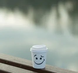 coffee to go cup by the water