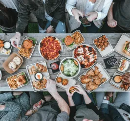 table of people sharing food viewed from above