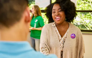 YMCA staff member giving someone a tour