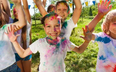 Kids laughing during a color run event