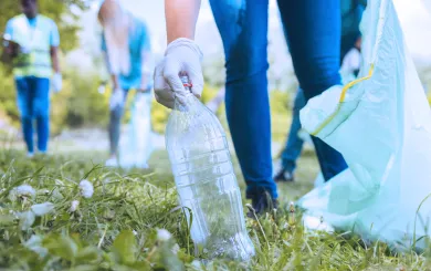 Volunteer picking up trash