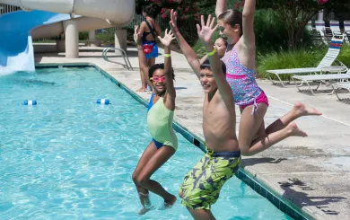 Kids jumping in the Meadowmont pool