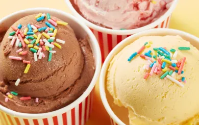 ice cream with sprinkles in round colorful cups