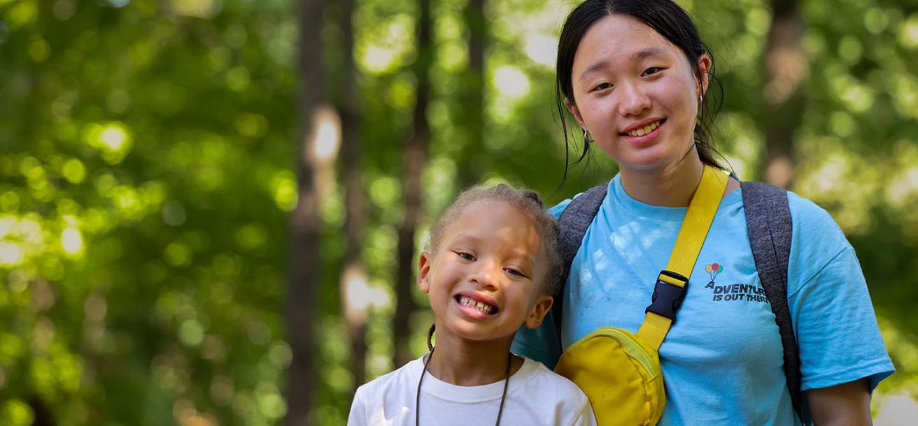 Counselor and child at camp