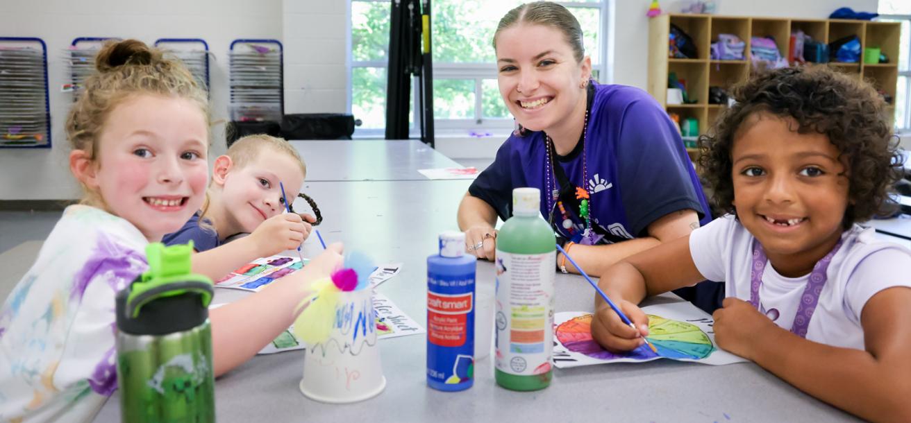 Kids working on a craft at YMCA day camp.