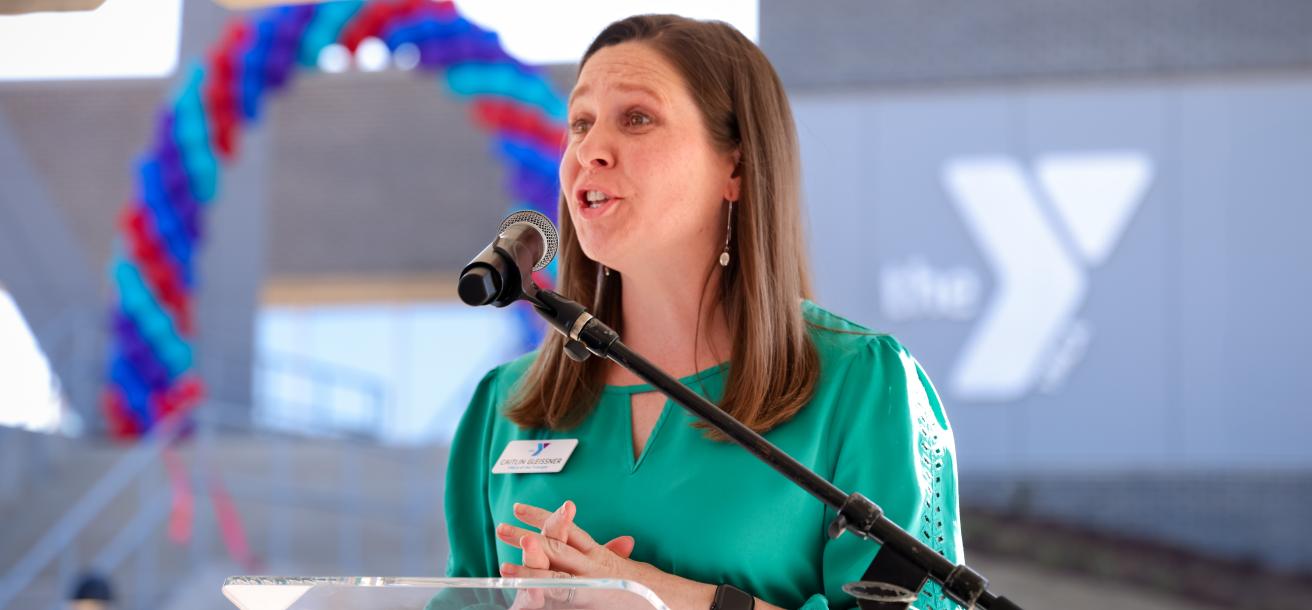 Caitlin Gleissner, Executive Director of the Chatham Park YMCA, speaking at the ribbon cutting in March 2025.