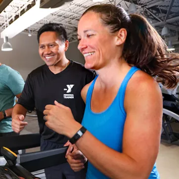 Personal Trainer with member at the YMCA