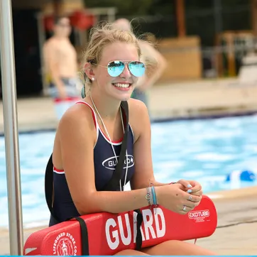 Lifeguard beside the pool