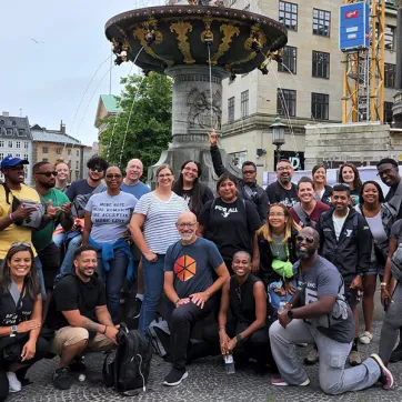 a group of people standing near a fountain in Denmark